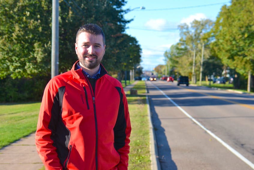 Liberal candidate Zac Murphy stands along Brackley Point Road in Charlottetown-Winsloe. Murphy is the youngest of the four candidates competing for a seat in the byelection.  